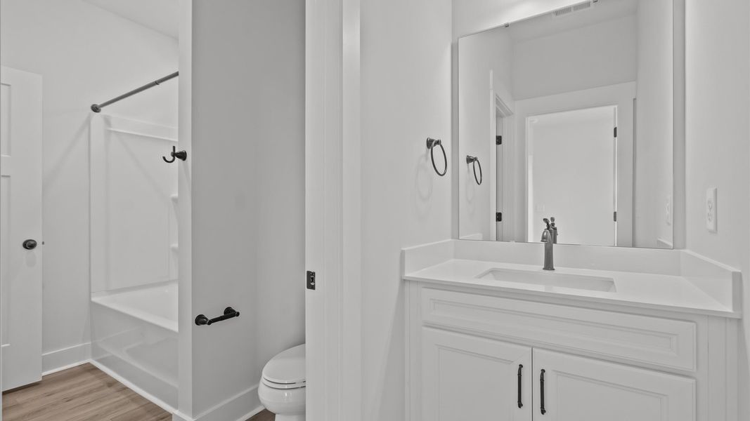 Elegant bath retreat with designer finishes and a clean, timeless aesthetic