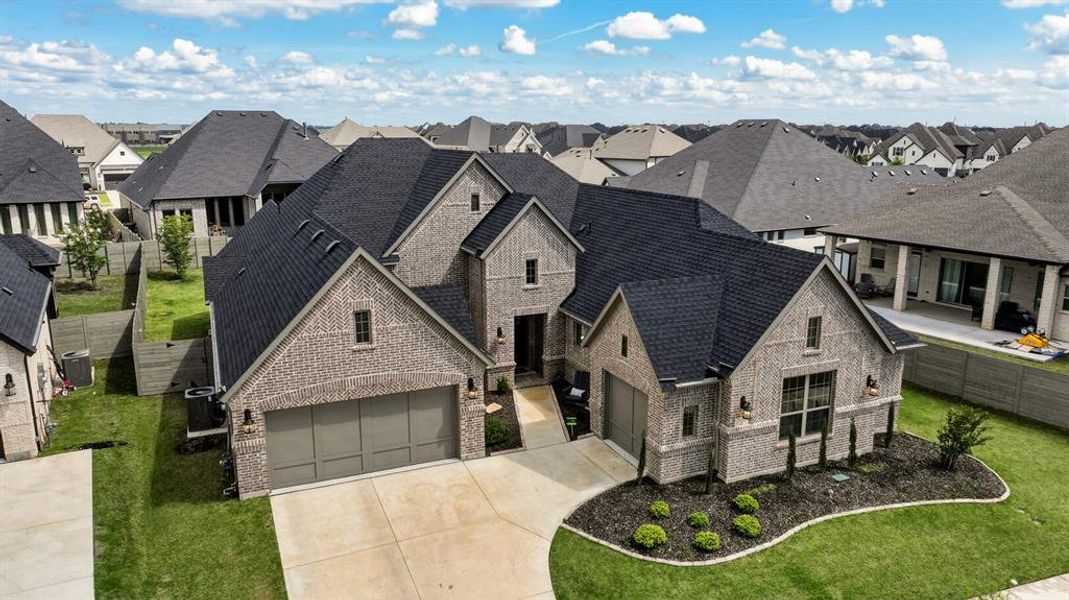 Front exterior of a new home in , Argyle, TX, highlighting curb appeal (Image 20). Front exterior of a new home in , Argyle, TX, highlighting curb appeal (Image 20).