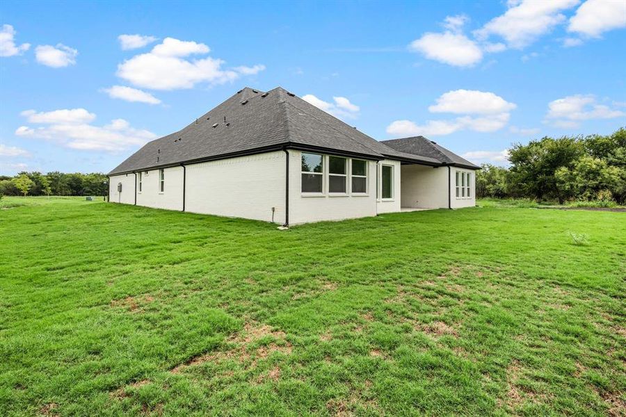 Front exterior of a new home in Rolling Creek Ranch, Aledo, TX, highlighting curb appeal (Image 24). Front exterior of a new home in Rolling Creek Ranch, Aledo, TX, highlighting curb appeal (Image 24).