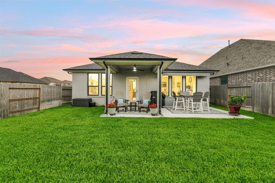 This beautiful home features full gutters and sprinkler system.