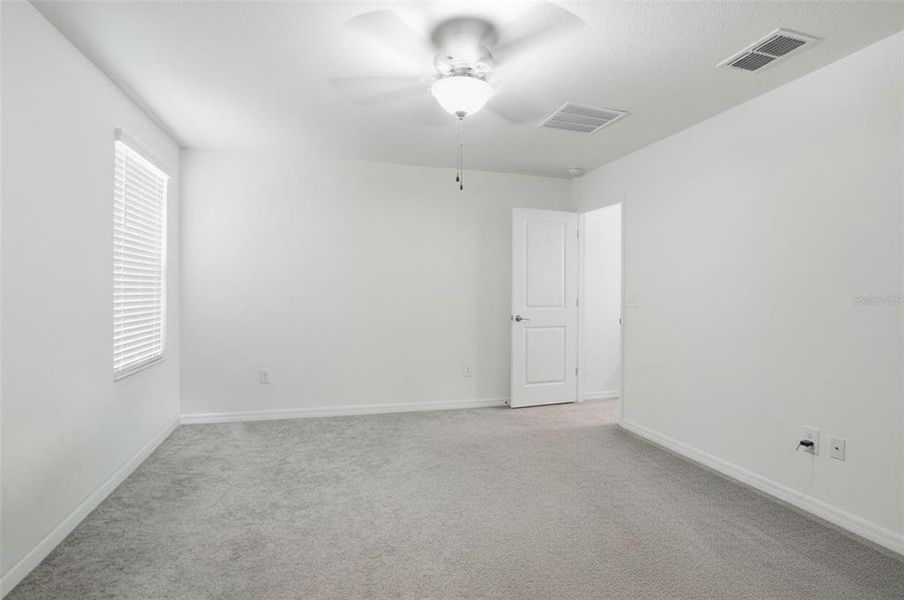 Spacious, unfurnished interior of a new home in The Isle of Avalon, Spring Hill (Image 22).