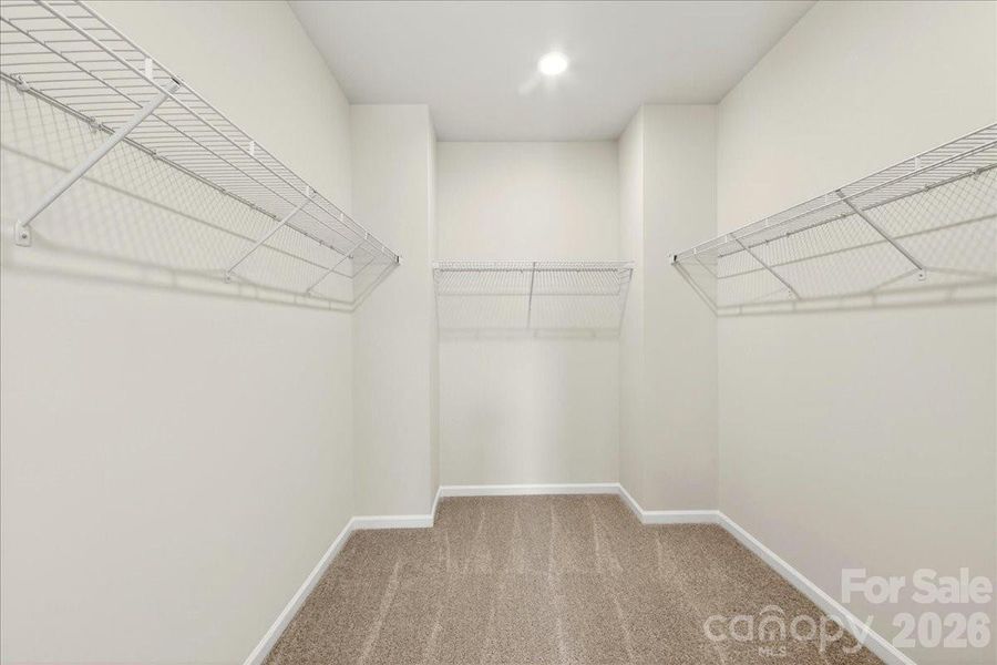 Primary walk-in closet Primary walk-in closet