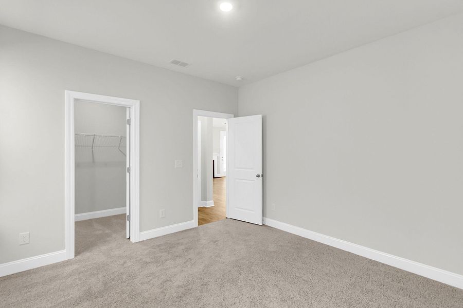 Spacious, unfurnished interior of a new home in Tidewater at Lakes of Cane Bay, Summerville (Image 34).