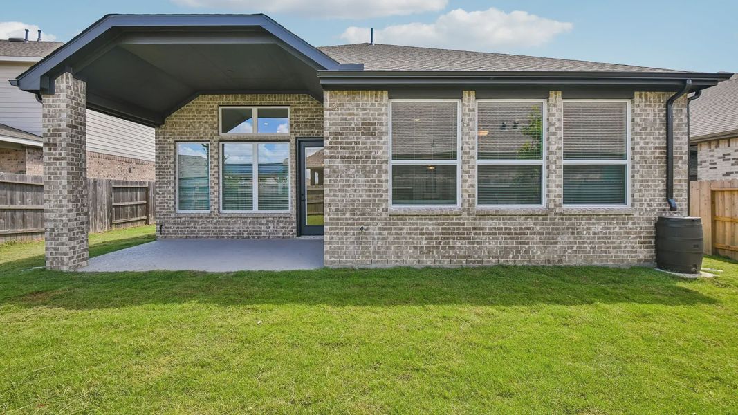 Exterior details and patio area of a home in Artavia, Conroe (Image 4).