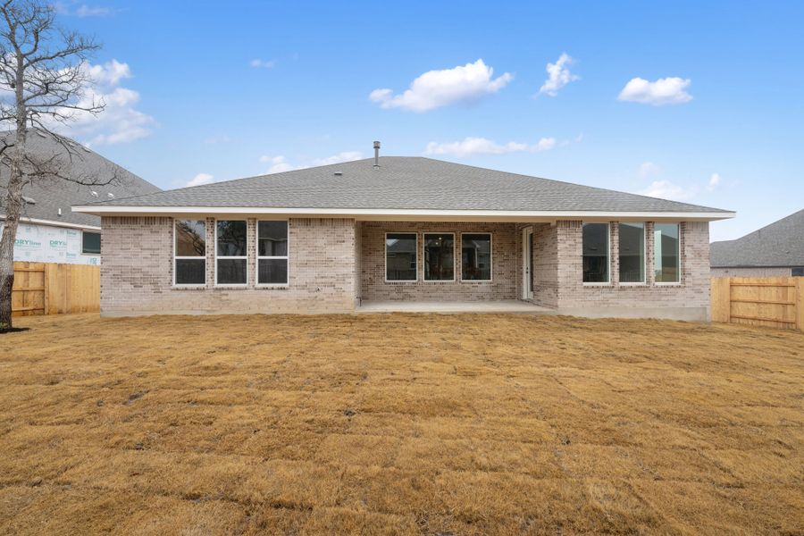 Representative exterior photo of a completed home built from the Carolina by Ashton Woods in The Estates at La Cima, San Marcos, TX (Image 25). Representative exterior photo of a completed home built from the Carolina by Ashton Woods in The Estates at La Cima, San Marcos, TX (Image 25).