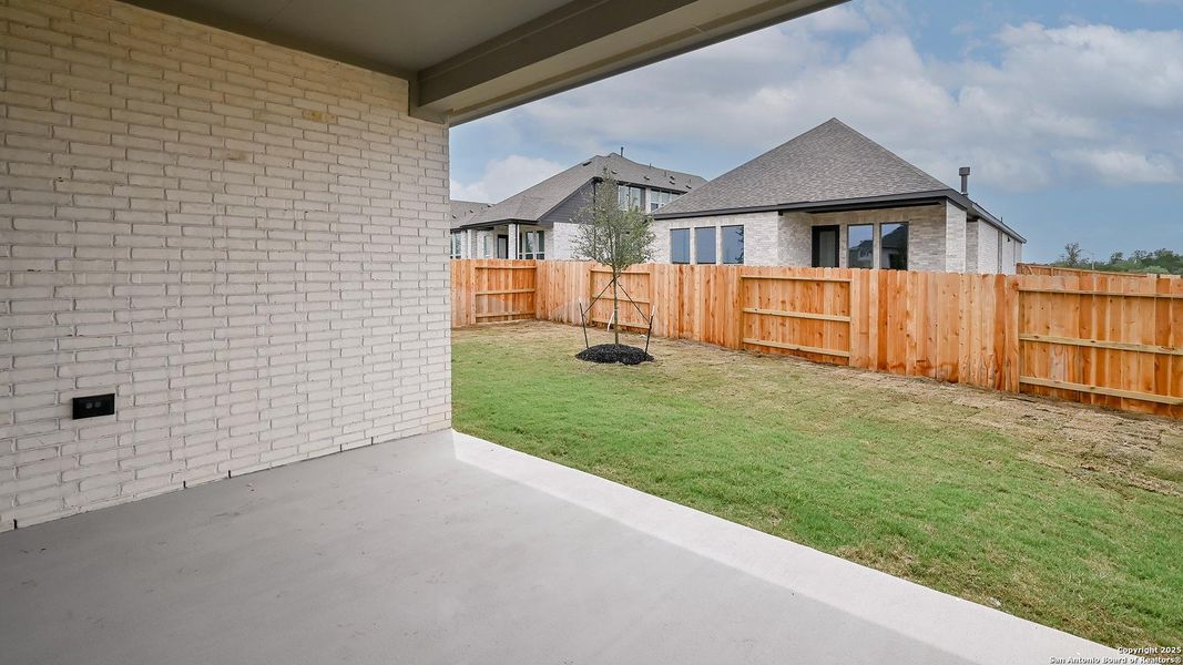 Front exterior of a new home in Homestead 55', Cibolo, TX, highlighting curb appeal (Image 24). Front exterior of a new home in Homestead 55', Cibolo, TX, highlighting curb appeal (Image 24).