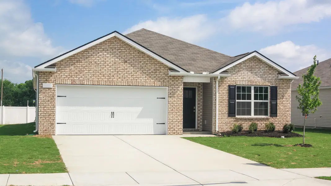 Front exterior of a new home in Villages of Hunters Point, Lebanon, TN, highlighting curb appeal (Image 1).