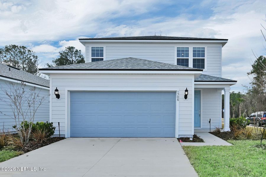 Front exterior of a new home in Murray Farms, Middleburg, FL, highlighting curb appeal (Image 1). Front exterior of a new home in Murray Farms, Middleburg, FL, highlighting curb appeal (Image 1).