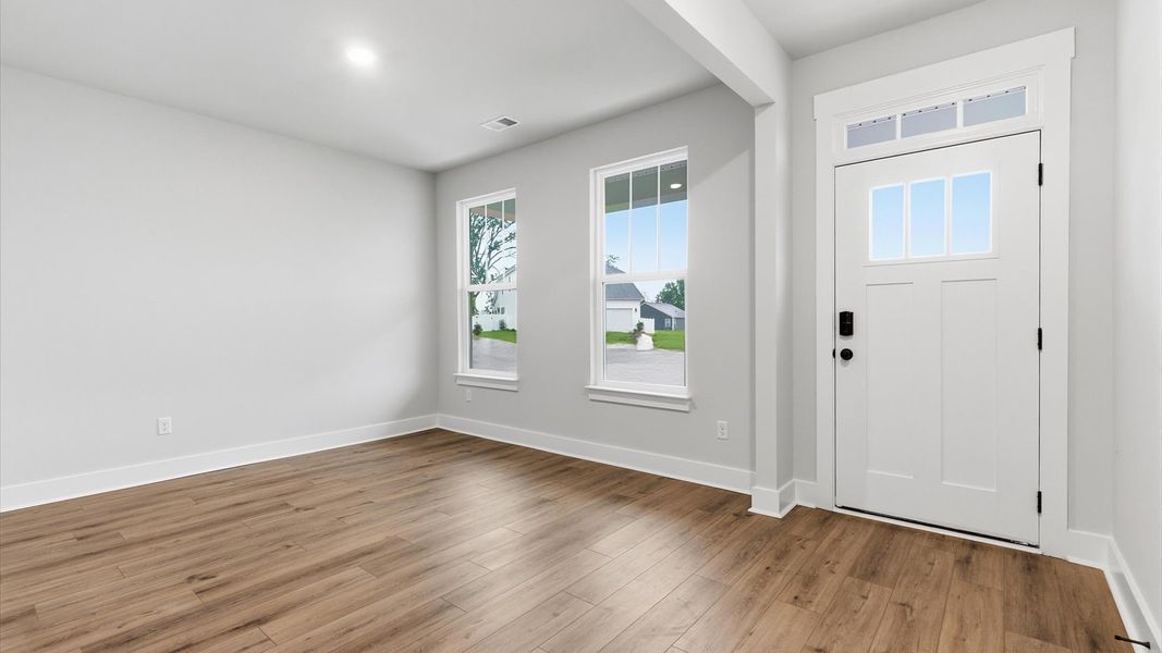 Notable hardwood flooring enhances the elegance of this accomplished entryway at Woodglen Notable hardwood flooring enhances the elegance of this accomplished entryway at Woodglen