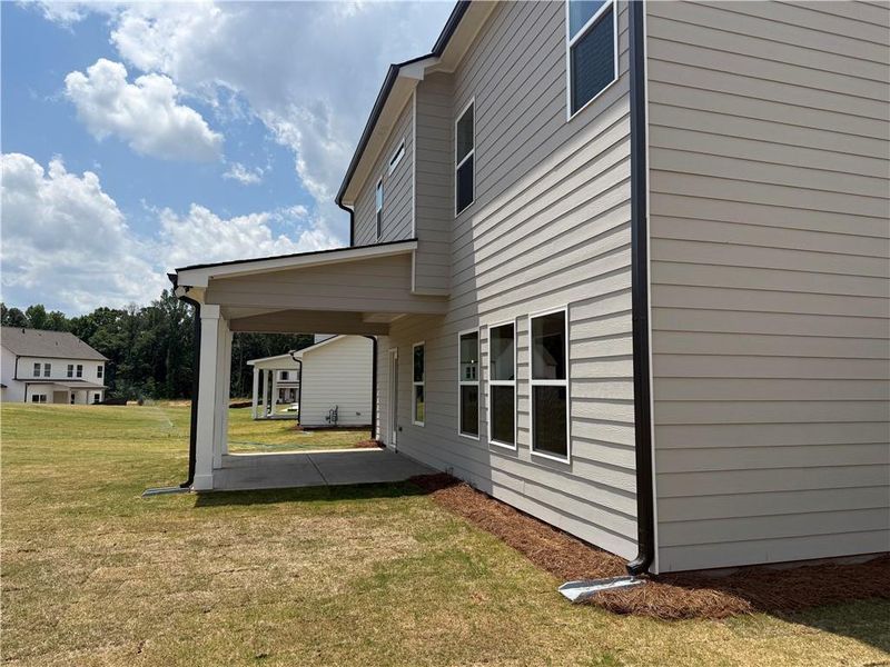 Exterior details and patio area of a home in Rosewood Lake Estates, Hoschton (Image 4). Exterior details and patio area of a home in Rosewood Lake Estates, Hoschton (Image 4).
