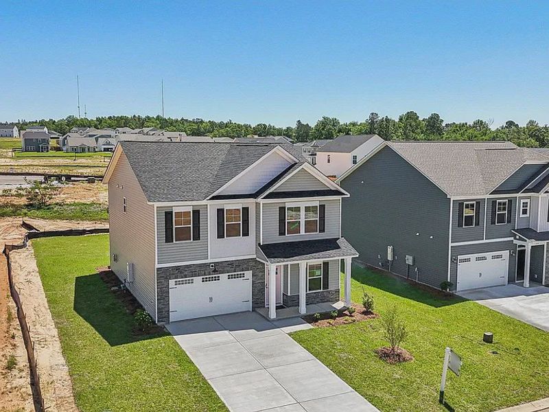 Front exterior of a new home in Providence Station at Trolley Run, Aiken, SC, highlighting curb appeal (Image 17). Front exterior of a new home in Providence Station at Trolley Run, Aiken, SC, highlighting curb appeal (Image 17).