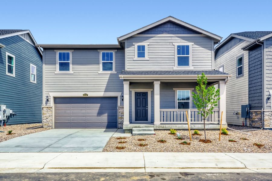 Front exterior of a new home in Muegge Farms, Bennett, CO, highlighting curb appeal (Image 1). Front exterior of a new home in Muegge Farms, Bennett, CO, highlighting curb appeal (Image 1).