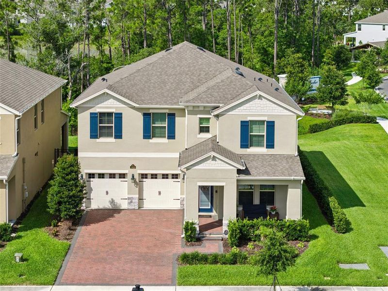 Front exterior of a new home in , Winter Garden, FL, highlighting curb appeal (Image 26).