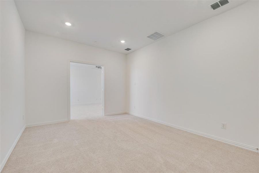 Unfurnished room with light colored carpet