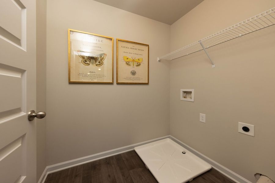 Laundry room located upstairs off hallway