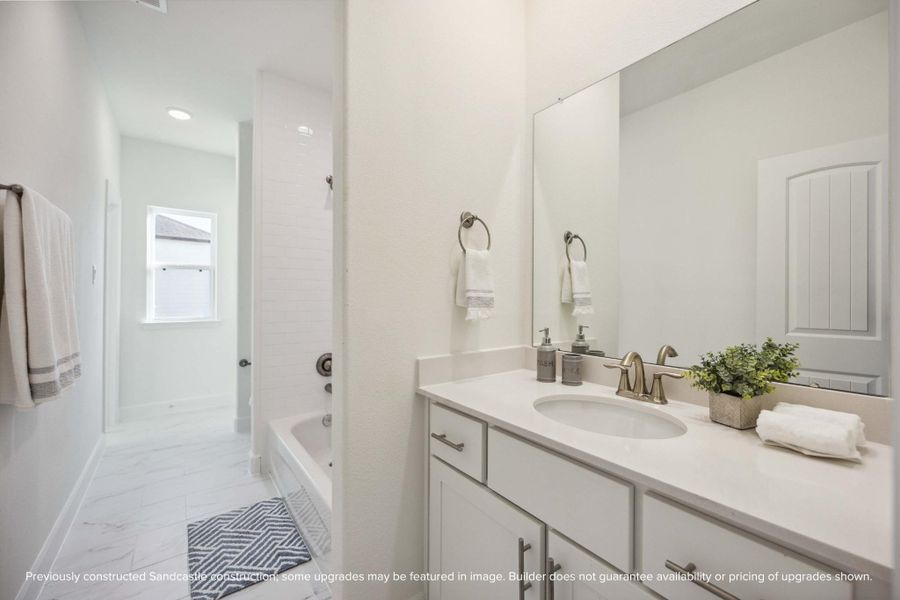 Flooded with light and finished with care, this hall bath delivers both function and finesse. Bonus points for that deep tub and elevated tilework. Flooded with light and finished with care, this hall bath delivers both function and finesse. Bonus points for that deep tub and elevated tilework.