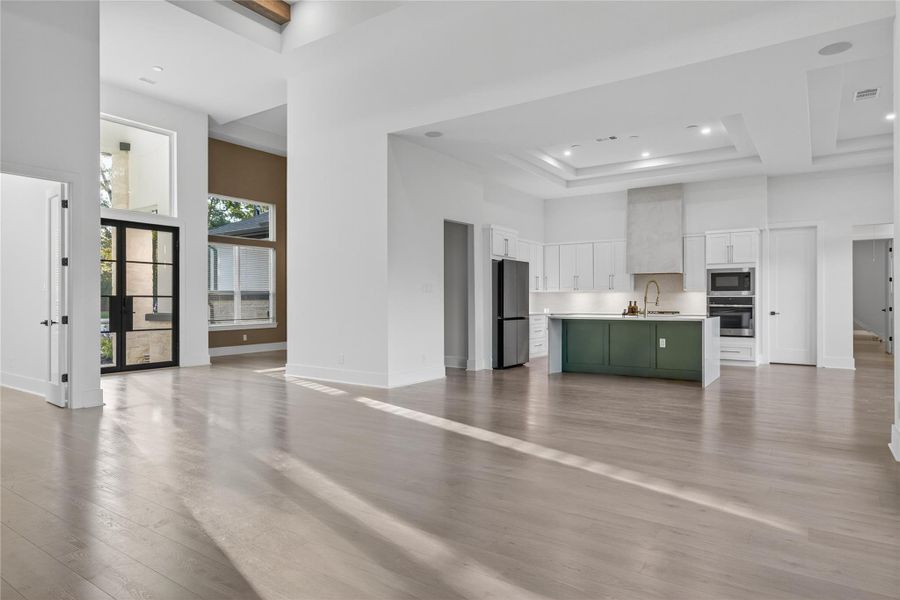 Expansive open-concept living area provides plenty of room for gathering while maintaining a bright and airy feel. **Images are from a previously completed project. **