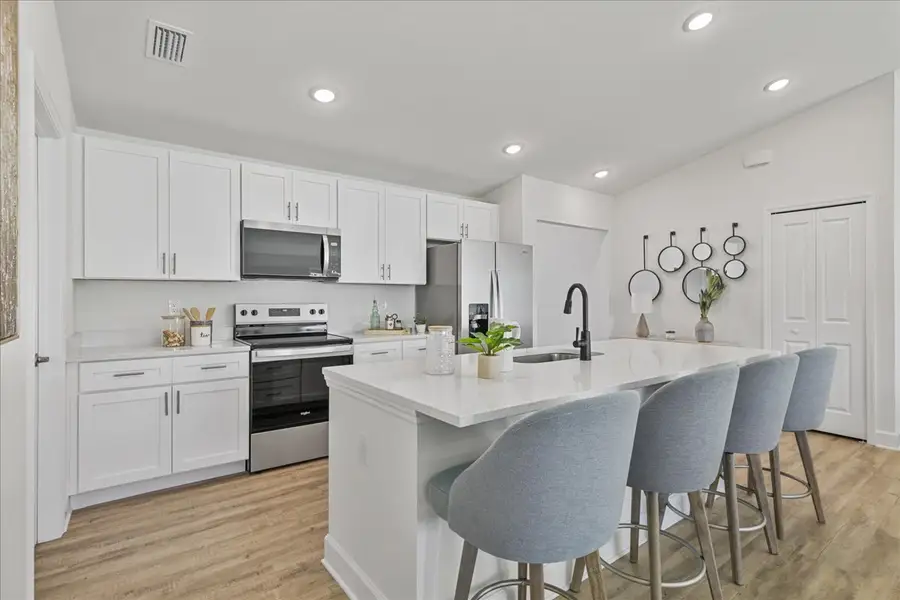 Representative furnished interior of a home built from the The Sunset Harbor by Sunlife Homes LLC in Cape Coral, Cape Coral (Image 5).