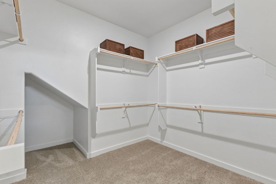 Primary Closet in a Sunset Ranch Winters Model Home in Gunter TX by Trophy Signature Homes