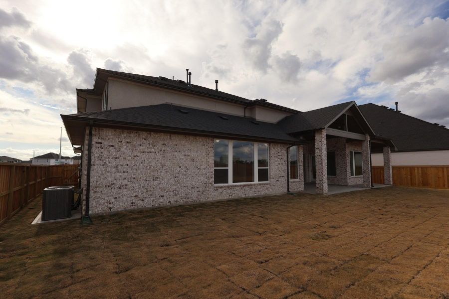 Exterior details and patio area of a home in Dunham Pointe, Cypress (Image 4).