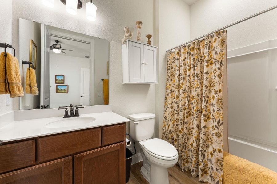 Ensuite bathroom for guest bedroom #2. Features Miami White Quartz counters, American Beech-Chateau cabinets, and upgraded oil rubbed bronze Dartmoor faucet and oil rubbed bronze bath hardware and fixtures. There are also upgraded Aubrey Olde Bronze light fixtures. Ensuite bathroom for guest bedroom #2. Features Miami White Quartz counters, American Beech-Chateau cabinets, and upgraded oil rubbed bronze Dartmoor faucet and oil rubbed bronze bath hardware and fixtures. There are also upgraded Aubrey Olde Bronze light fixtures.