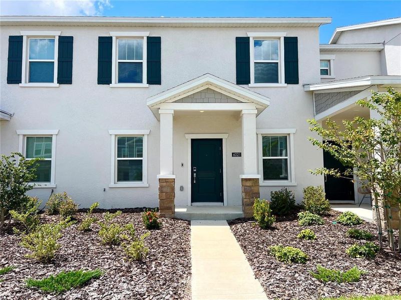 Front exterior of a new home in , Clermont, FL, highlighting curb appeal (Image 28).