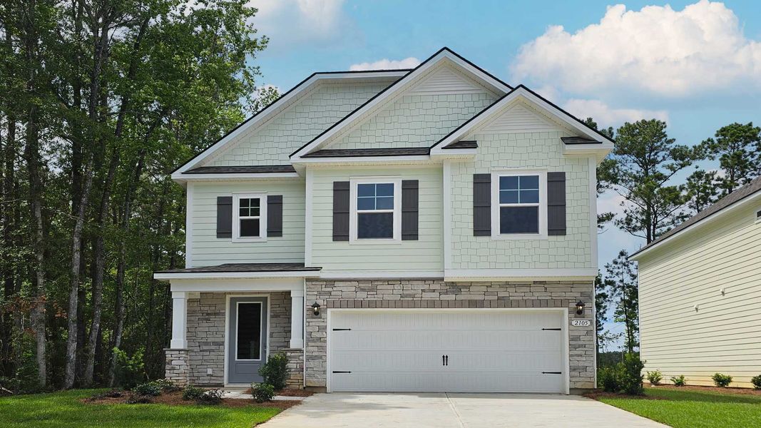 Front exterior of a new home in Chapman Village, Conway, SC, highlighting curb appeal (Image 1). Front exterior of a new home in Chapman Village, Conway, SC, highlighting curb appeal (Image 1).