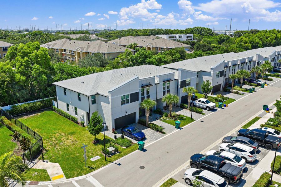 Front exterior of a new home in Enclave at Mangonia Park, West Palm Beach, FL, highlighting curb appeal (Image 19).