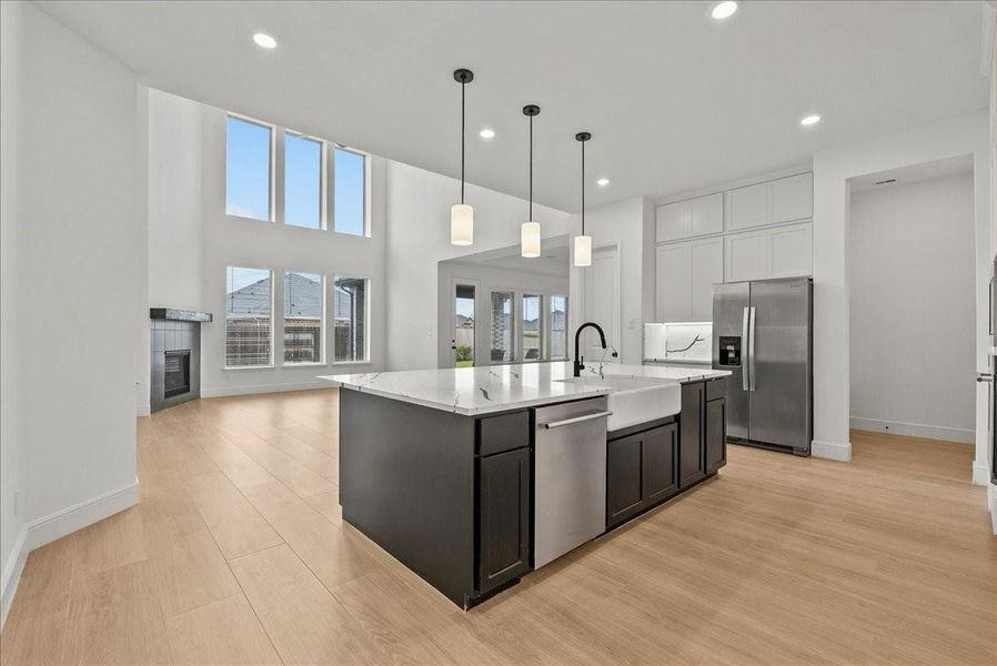 Kitchen opens seamlessly to the inviting living room