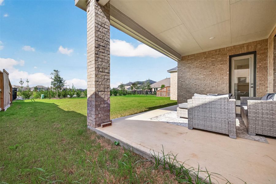 Exterior details and patio area of a home in , Brookshire (Image 25).