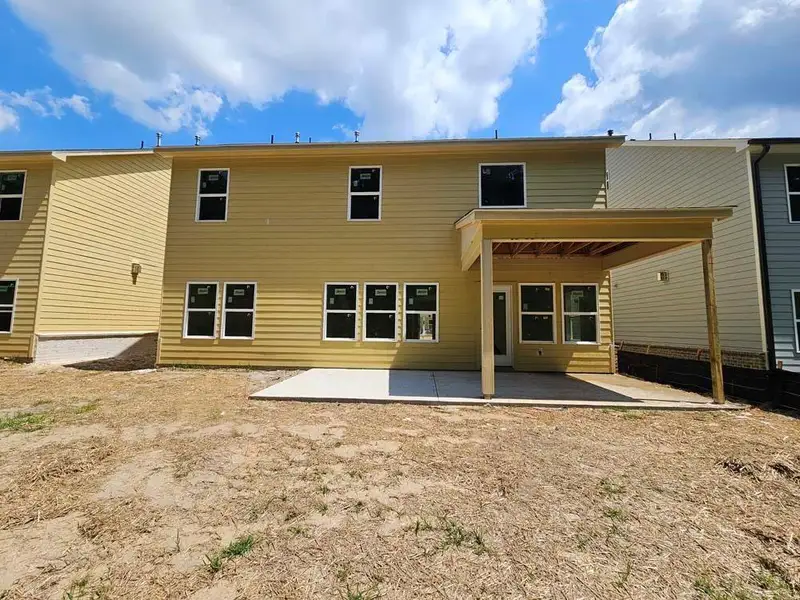 Exterior details and patio area of a home in Arbors at Richland Creek, Buford (Image 18).