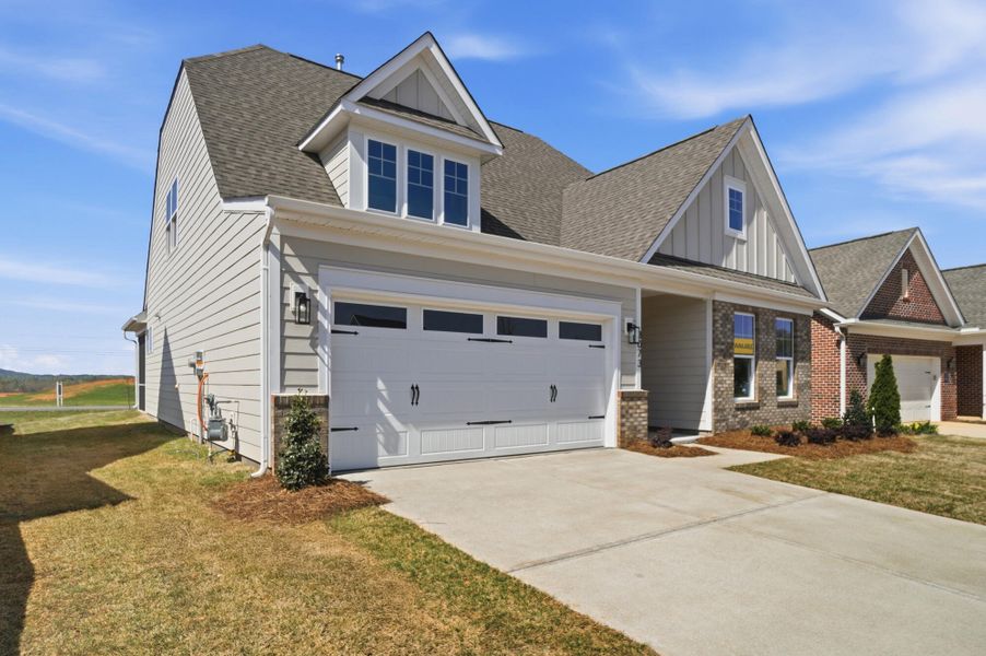 Front exterior of a new home in Founders Landing | 55+ Community, Gastonia, NC, highlighting curb appeal (Image 22). Front exterior of a new home in Founders Landing | 55+ Community, Gastonia, NC, highlighting curb appeal (Image 22).
