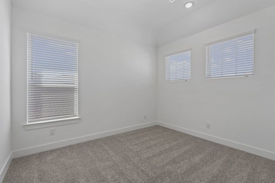 Representative unfurnished interior of a home built from the Waterford by Chesmar Homes in Meridiana 60's, Manvel (Image 38).