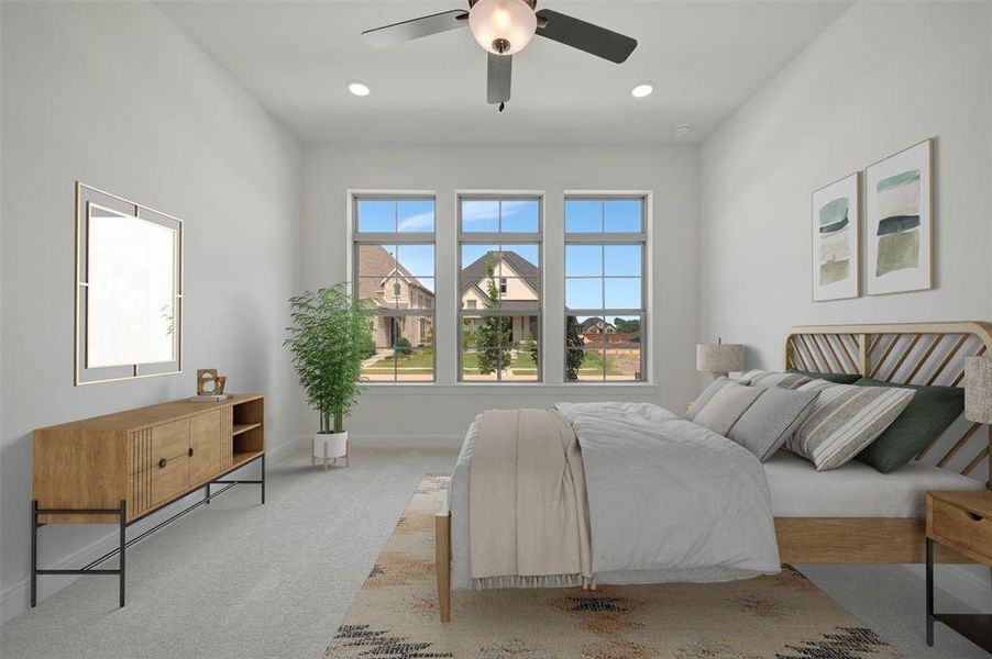 Spacious room featuring three large windows, a ceiling fan with integrated lighting, recessed lighting, and light-toned carpeting
