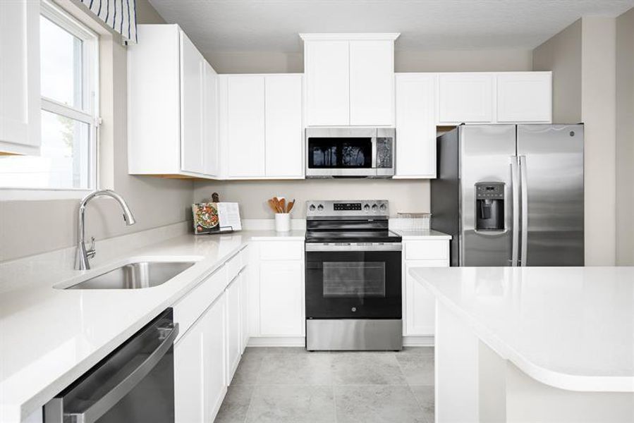Representative furnished interior of a home built from the Piper End Unit by Ryan Homes in Terra Lago Townhomes, Indiantown (Image 2).