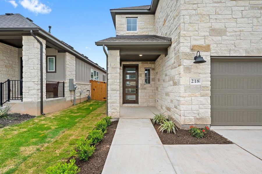 Exterior details and patio area of a home in Heritage, Dripping Springs (Image 23).