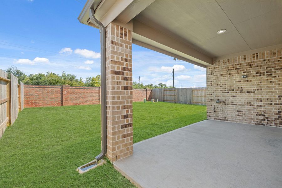 Exterior details and patio area of a home in Sunterra North, Katy (Image 3).