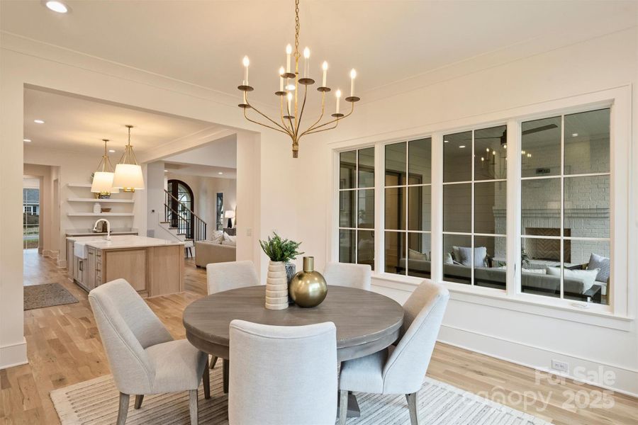 A dedicated dining room seamlessly integrates with the open floorplan, offering clear sightlines throughout the home.