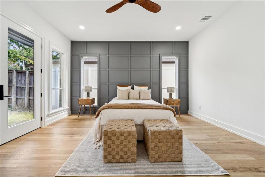 Bedroom featuring light hardwood flooring, access to exterior, and ceiling fan