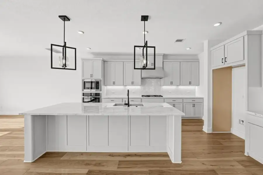 Furnished interior view inside a new home in Travisso, Leander (Image 7).