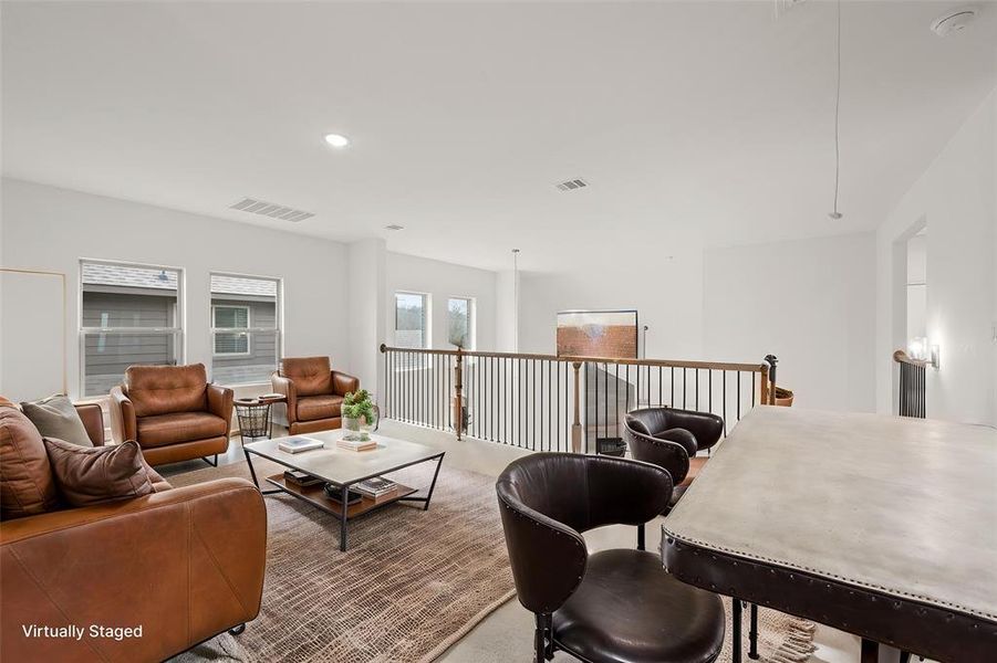 At the top of the stairs, a gameroom is waiting for your entertainment. This room is large and has flexible options for the best use.