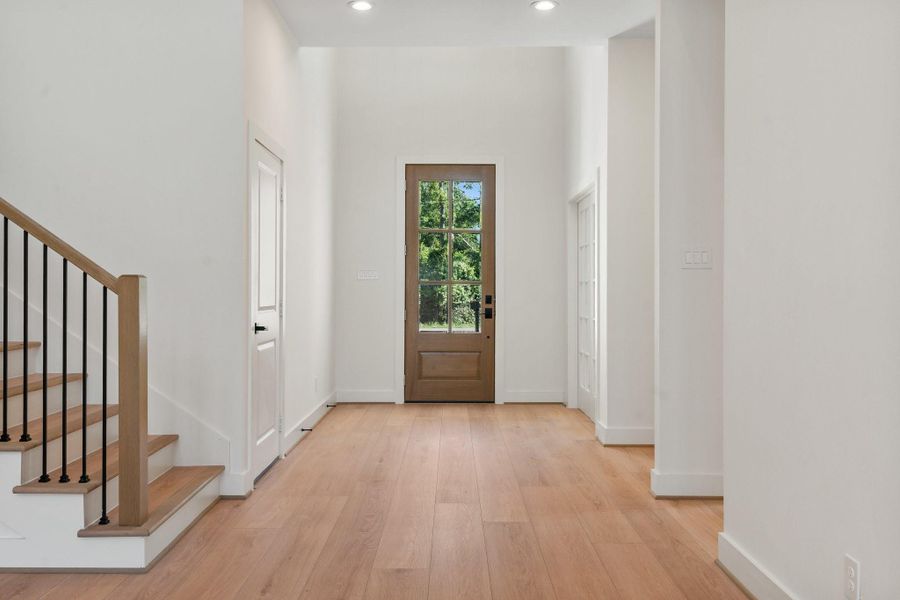 Step into a bright and elegant entryway that sets the tone for the home, featuring soaring ceilings, abundant natural light, and a welcoming sense of style and sophistication. Step into a bright and elegant entryway that sets the tone for the home, featuring soaring ceilings, abundant natural light, and a welcoming sense of style and sophistication.