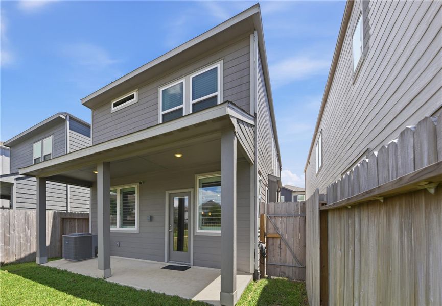 Exterior details and patio area of a home in Dunvale Village - Townhome Collection, Houston (Image 26).