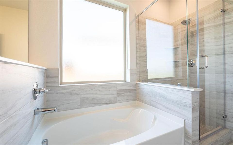 Bathroom with shower with separate bathtub