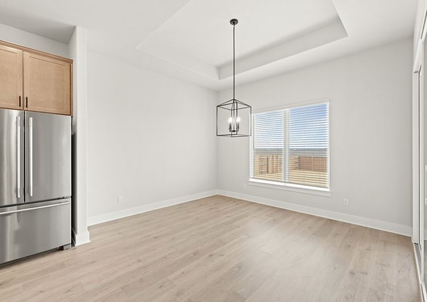 The dining room sits adjacent to the kitchen.