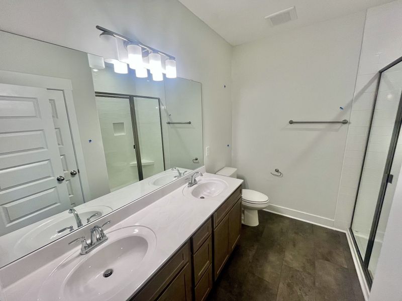 Double raised vanity , large shower and linen closet