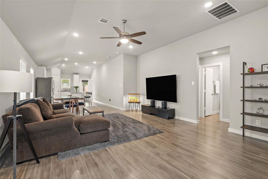 The spacious family room offers an open-concept design perfect for both everyday living and entertaining.