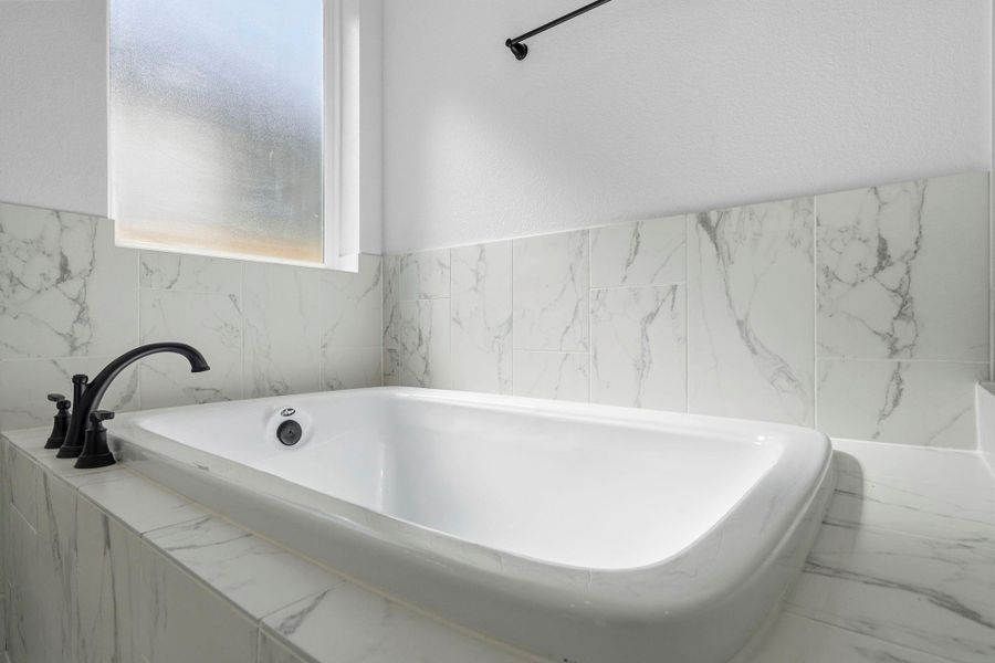 Escape to a serene retreat in this beautifully designed primary bath, crafted to balance modern luxury with calming comfort.