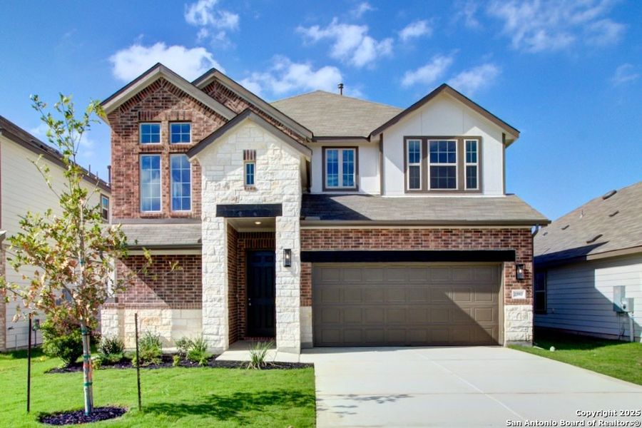 Front exterior of a new home in Dauer Ranch, New Braunfels, TX, highlighting curb appeal (Image 1). Front exterior of a new home in Dauer Ranch, New Braunfels, TX, highlighting curb appeal (Image 1).