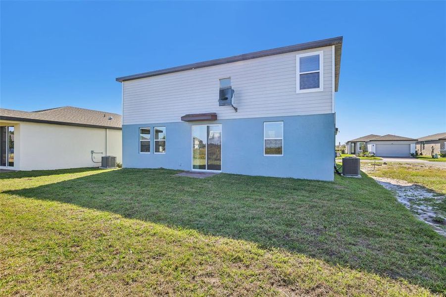 Exterior details and patio area of a home in Lake Deer Estates - Signature Series, Poinciana (Image 3).